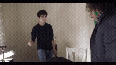 Man Holding Lit Candle Grand Cornichon GIF