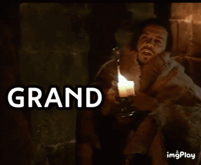 Man Holding Lit Candle With Grand Cornichon GIF