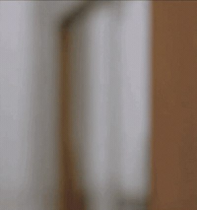 Man Holding Martini In Front Of Paramount Sign GIF