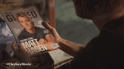 Man Holding Matt Hagen Magazine GIF