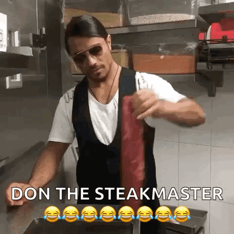 Man Holding Meat In Front Of Don The Steakmaster Sign GIF