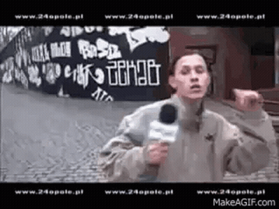 Man Holding Microphone Before Graffiti Wall Www.24opole.pl GIF