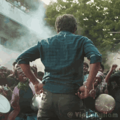 Man Holding Microphone In Front Of Crowd GIF