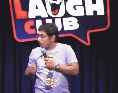 Man Holding Microphone In Laugh Club GIF