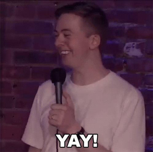 Man Holding Microphone Laughing Saying Yay GIF