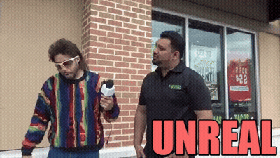 Man Holding Microphone Next To Man Unreal GIF