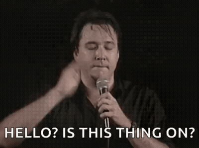 Man Holding Microphone Saying Hello Is This Thing On GIF