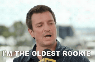 Man Holding Microphone Saying I'm The Oldest Rookie GIF