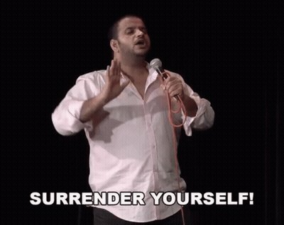 Man Holding Microphone Saying Surrender Yourself GIF