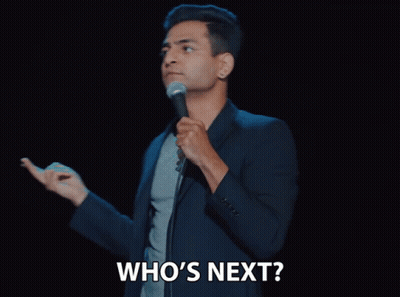 Man Holding Microphone Saying Who's Next GIF