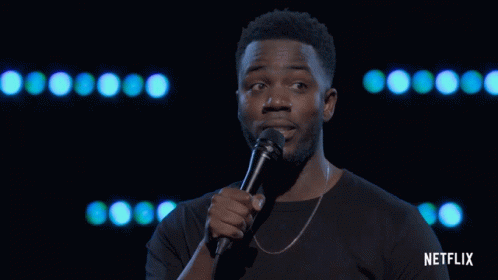 Man Holding Microphone With Netflix On Bottom GIF