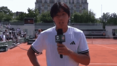 Man Holding Microphone With Number 4 GIF