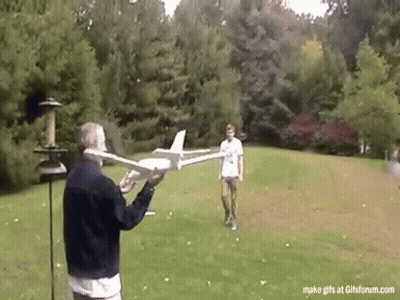Man Holding Model Airplane And Another Looking On GIF