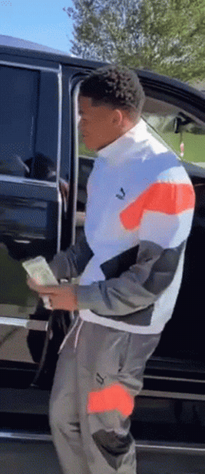 Man Holding Money Next To Car GIF
