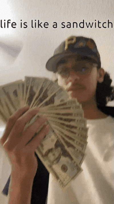 Man Holding Money Saying Life Is Like A Sandwich GIF