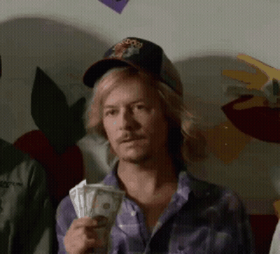 Man Holding Money Wearing Snoop Dogg Hat GIF