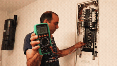 Man Holding Multimeter Saying 000 GIF