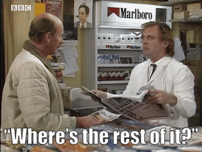 Man Holding Newspaper In Front Of Marlboro Display GIF
