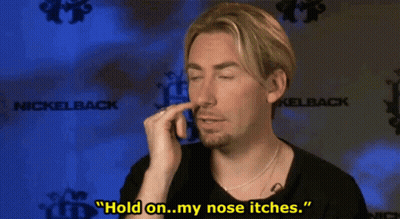 Man Holding Nose In Front Of Nickelback Logo GIF