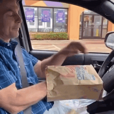 Man Holding Order Here Bag GIF