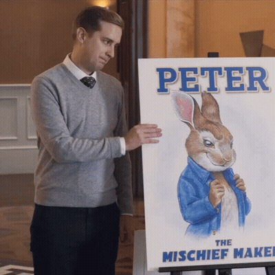 Man Holding Painting Of Peter The Mischief Maker GIF