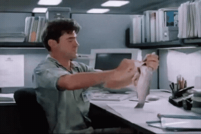 Man Holding Paper At Computer GIF