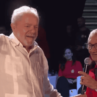 Man Holding Paper Giving Speech At Microphone GIF