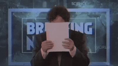 Man Holding Paper In Front Of Breaking News Sign GIF