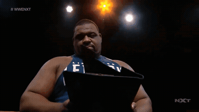 Man Holding Paper In Front Of Screen #Wwenext GIF