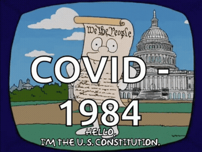 Man Holding Paper Saying Covid 1984 GIF