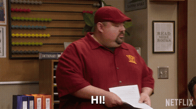 Man Holding Paper Saying Hi GIF