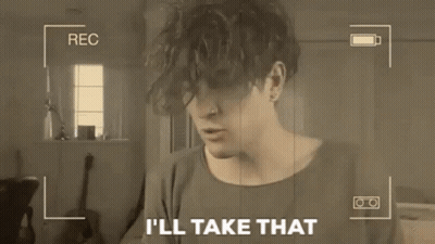 Man Holding Paper Saying I'll Take That On Camera GIF
