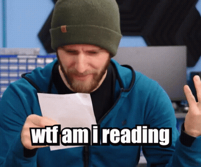 Man Holding Paper Saying WTF Am I Reading GIF