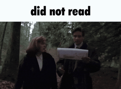 Man Holding Paper Woman Walking In Woods GIF