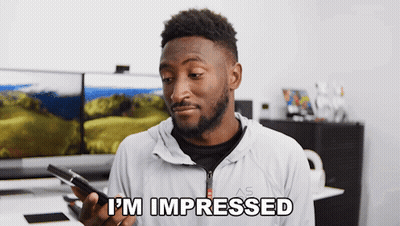 Man Holding Phone Saying I'm Impressed GIF
