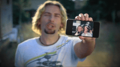 Man Holding Phone With Two Men GIF