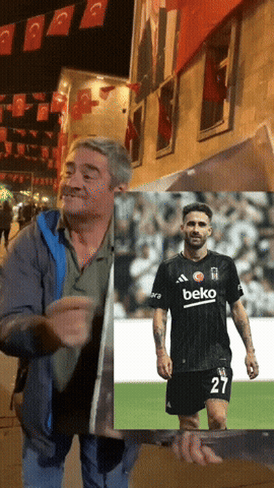 Man Holding Picture Of Man In Beko Shirt GIF