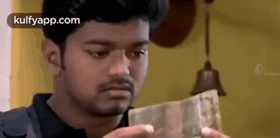 Man Holding Pile Of Money GIF