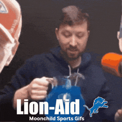 Man Holding Pitcher With Detroit Lions Logo GIF