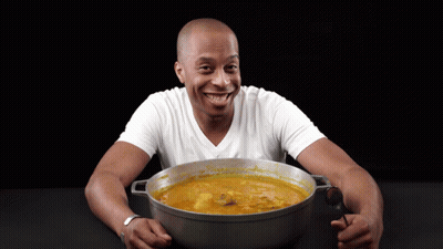 Man Holding Pot Of Soup Smiling GIF