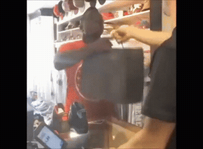 Man Holding Purse In Closet GIF