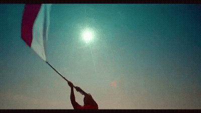 Man Holding Red And White Flag GIF