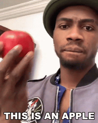 Man Holding Red Apple Saying This Is An Apple GIF