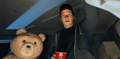 Man Holding Red Cup With Letter Z Next To Teddy Bear GIF