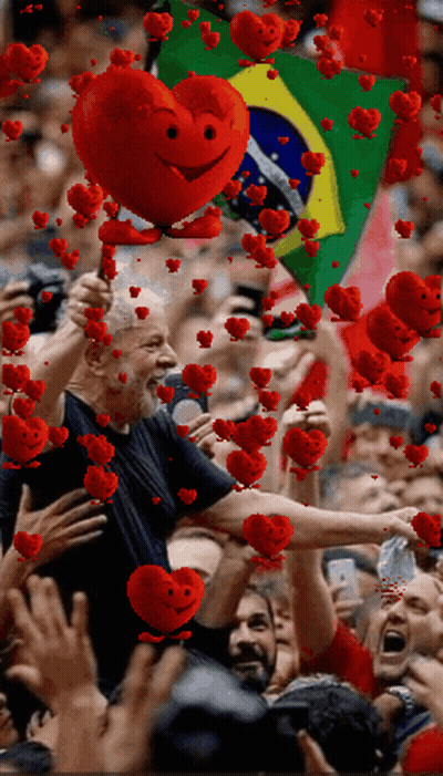 Man Holding Red Heart With Face Before Crowd GIF