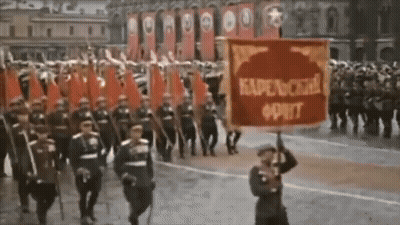 Man Holding Red Kapenckha Oprit Banner GIF