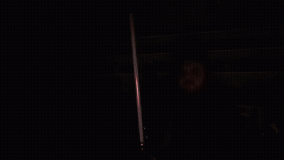 Man Holding Red Lightsaber GIF