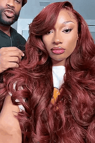 Man Holding Redhead Woman's Hair GIF