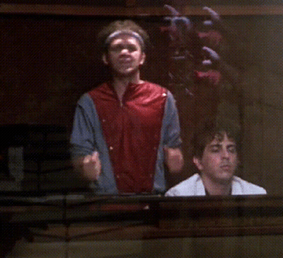 Man Holding Remote in Front of Truck Saying Dr.E. Brown
