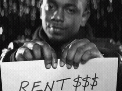 Man Holding Rent Sign GIF